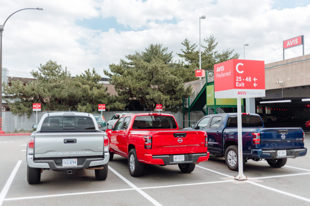 pick-up trucks parked in Avis lot